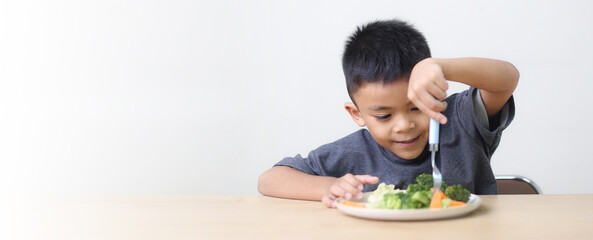 Nutrition healthy eating habits for kids concept. Children do not like to eat vegetables. Little...