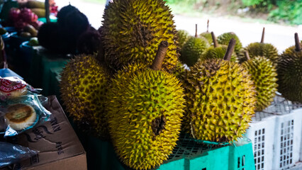 Fresh Durians on Display at a Market Stall
