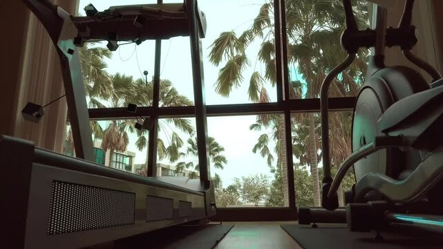 CG Abstract Human walking on a Treadmill in a Gym on a Tropical Location with Palm Trees