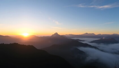 Obraz premium Sunrise Over Misty Mountain Ranges A Scenic View