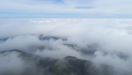 Obraz premium Mountains Enveloped In A Sea Of Clouds