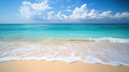 Obraz premium Tropical Beach Paradise Turquoise Ocean, White Waves, and Blue Sky with Fluffy Clouds.