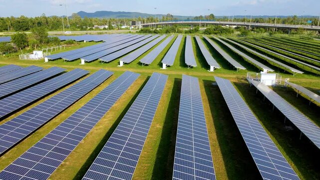 Vast rows of solar panels capture sunlight in Thailand, contributing to sustainable energy efforts. This solar park highlights the importance of renewable resources for a cleaner future.