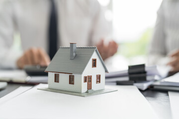 Sales manager giving advice application form document, considering mortgage loan offer for car and house insurance. Real estate investment Property 