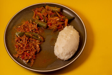 Matemba or Kapenta Fish (Limnothrissa miodon, Lake Tanganyika Sardine) and Okra Stew served with corn meal pap