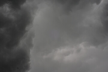 The dark sky with heavy clouds converging and a violent storm before the rain.Bad or moody weather...