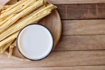Tofu milk on wood background