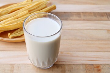 Tofu milk on wood background