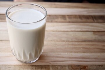 Tofu milk on wood background