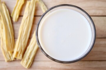 Tofu milk on wood background