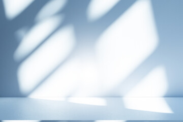Wall interior background, studio and backdrops show products. with soft light shadow from window color blue and white. background for text insertion and presentation of product	
