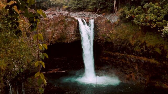 Rainbow Fall Water Fall Surrounded By Green Foliage In Hilo Hawaii Slow Lotion 1920 By 1080 HD
