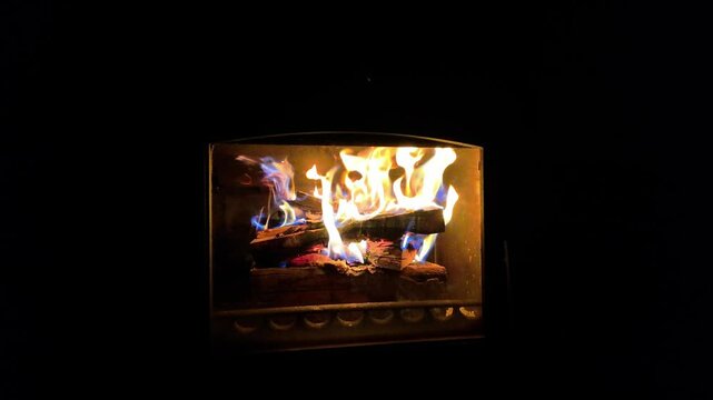 Burning fireplace in the darkess