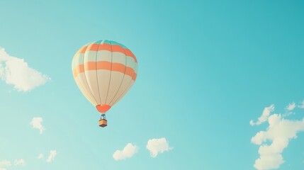 Fototapeta premium Vintage Hot Air Balloon Soaring in a Clear Teal Sky with Soft Clouds.