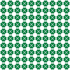 Seamless geometric pattern with green clover shapes on a white background. Modern trendy design with more patterns.