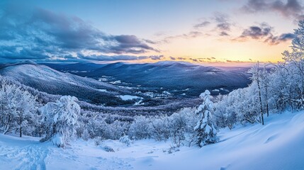 Snowy Mountain Landscape at Sunset with a Beautiful Sky and Layers of Snow Covered Trees