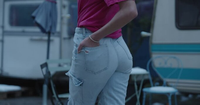 Woman standing in Jeans, Focus on Backview close up