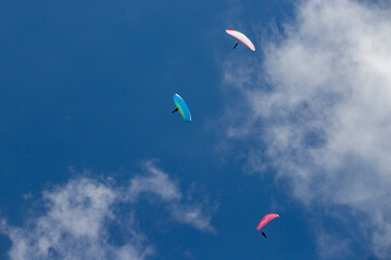 Paragliders above the alps in the dolomites, South Tyrol