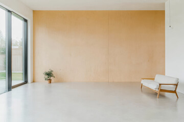 Minimalist room with natural light and a simple sofa invites relaxation and calmness