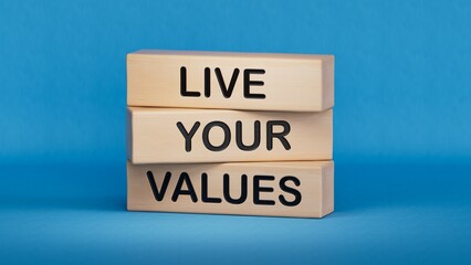 Live your values symbol. Concept words Live your values on wooden blocks.Business and Live your values concept. Copy space.3D rendering on blue background.