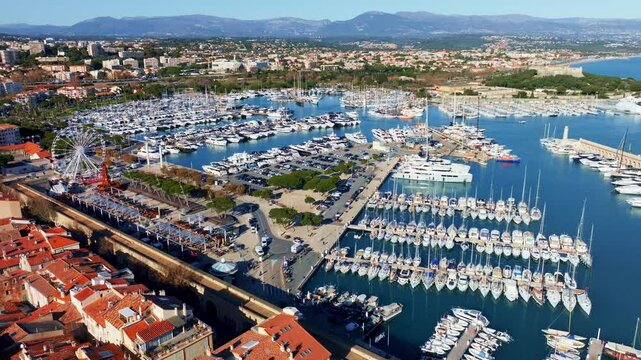 Antibes resort in the south of France, Antibes port with yachts in the harbour, French Riviera aerial view, drone shot of Antibes