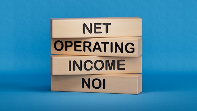 NOI - Net Operating Income symbol. Concept word NOI on wooden cubes.Business and NOI concept. Copy space.3D rendering on blue background.