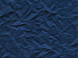 Dark Blue Wrinkled Fabric Texture Background Creates a Textured and Visual Effect.