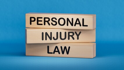 Personal Injury Law symbol. Concept words Personal Injury Law on wooden blocks.  Healthcare and Personal Injury Law concept. Copy space.3D rendering on blue background.