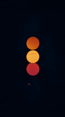 Three Glowing Orange and Red Circles Shine Brightly Against a Dark Background