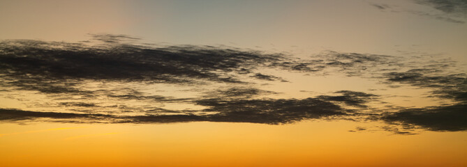 Sunset clouds are gathering. Panoramic sunrise or sunset sky with clouds. Sunset Sky on Twilight in the Evening with Sunset. Cloud Nature Sky Backgrounds. Sky Sunrise, Dusk clouds.