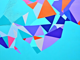 Abstract Geometric Shapes Mural with Vibrant Colors and Triangular Patterns on a Teal Background.