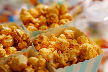 Caramel popcorn cups for a festive dessert. A simple and delicious candy bar for a party.