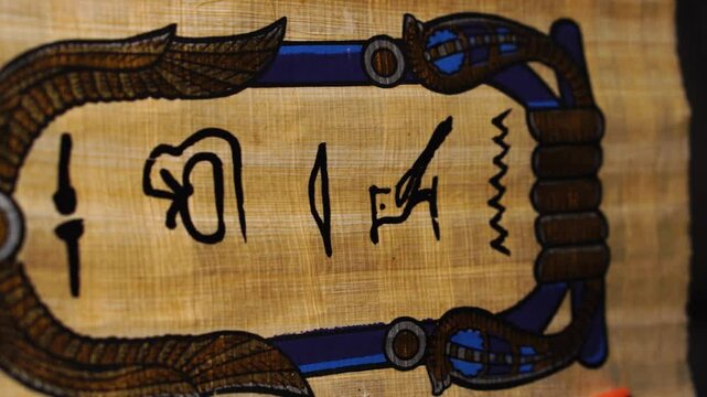 Egyptian Hieroglyphs Written on Old Papyrus Parchment Paper, Close Up