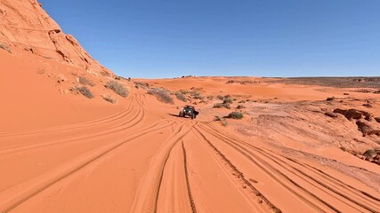 Sand Hollow 4x4 red sand dune Utah POV 4K. Point of view driving extreme off road vehicle. Red sandstone, dirt, sand trails. Nature erosion  canyons, valley and rocks. Outdoor extreme 4x4.
