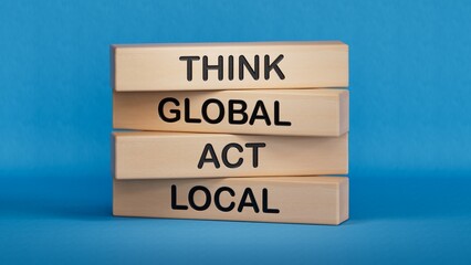 Think global act local symbol. Wooden blocks with words Think global act local .Business and Think global act local concept. Copy space.3D rendering on blue background.