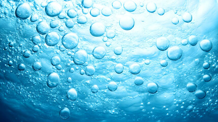 Underwater Bubbles Rise in Clear Blue Water Creating a Dreamlike Underwater Scene