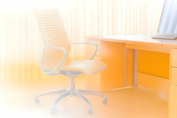 Modern Office Interior Shows Desk, Chair, and Computer Efficiently Illuminated in Warm Light.