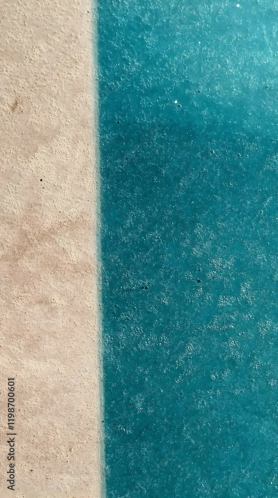 Poster tan and teal textured surfaces meet in a vertical divide with a subtle gradient.