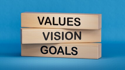 Values Vision Goals symbol. Concept words Values Vision Goals on wooden blocks.Business and Values Vision Goals concept. Copy space.3D rendering on blue background.