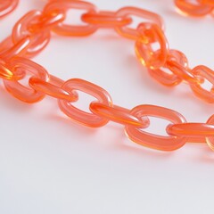 close up of orange acrylic chain links on a white background
