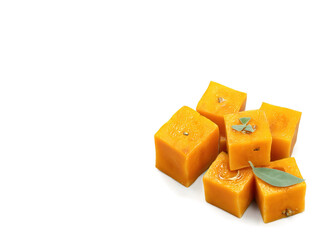 Roasted butternut squash cubes tossed with sage and brown butter, caramelized edges, nutty aroma, moody lighting