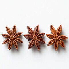 three star anise spices on a white background