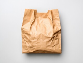 crumpled brown paper bag on a white background