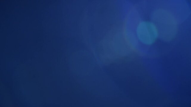 4K optical lens flare, light leaks, studio flare, flash lights, film burns, transition, studio flare on dark background