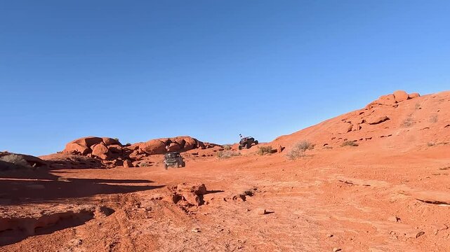 Sand Hollow desert red rock follow 4x4 Utah POV. Point of view driving extreme off road vehicle. Red sandstone, dirt, sand trails. Nature erosion  canyons, valley and rocks. Outdoor extreme 4x4.