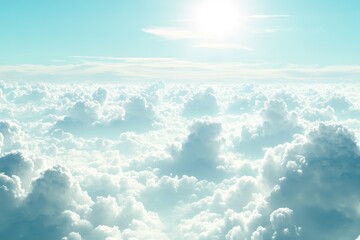 An aerial view of a bright, sunny day with a vast expanse of fluffy white clouds, the blue sky above them with the sun shining brightly.