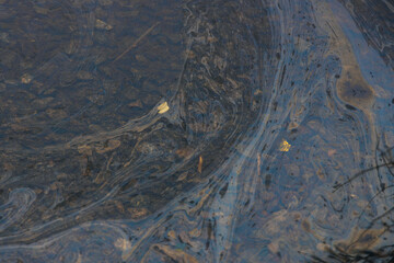 Gasoline or oil stain spill water pollution. Industrial oil fuel stain spill water pollution....