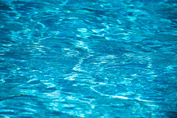 Blue ripped water in swimming pool, water pool texture and surface water backgraund.