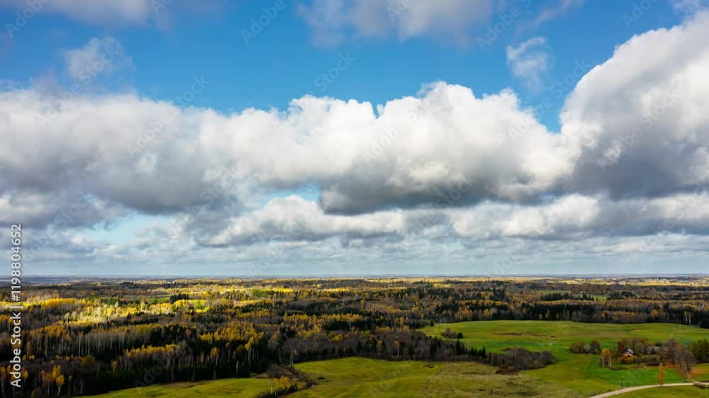 Aufkleber aerial drone hyperlapse over a large area of forest with fast moving clouds in the sky. vast views o