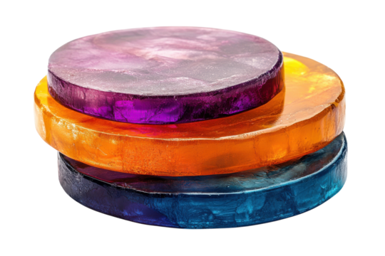 Colorful layered gelatin circles displayed on a white background create a vibrant, appealing visual for culinary artistry